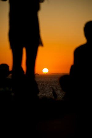 Silhouette of people enjoying the beautiful sunset. mother nature
