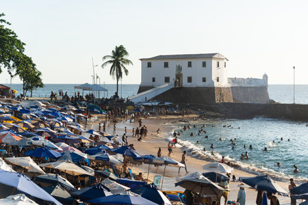 Salvador, Bahia, Brazil - October 21, 2023: View of Porto da Barra full of people bathing in the sun and sea in the city of Salvador, Bahia.のeditorial素材