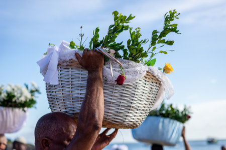 Salvador, Bahia, Brazil - January 30, 2022: Candomble fans are carrying gifts for Iemanja in the city of Salvador, Bahia.のeditorial素材
