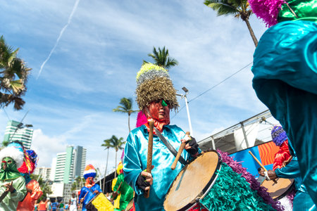 Salvador, Bahia, Brazil - February 11, 2023: Members of the Zambiapunga cultural group are parading in custom at Fuzue, pre-carnival in the city of Salvador, Bahia.のeditorial素材