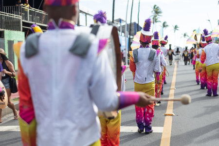Salvador, Bahia, Brazil - February 11, 2023: Rear view of group of musicians playing wind instruments during Fuzue pre-carnival in the city of Salvador, Bahia.のeditorial素材