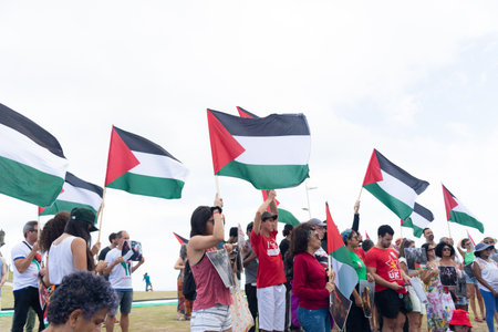 Salvador, Bahia, Brazil - November 11, 2023: Protesters are seen holding the Palestinian flag during a peaceful protest in the city of Salvador, Bahia.のeditorial素材