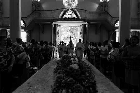 Salvador, Bahia, Brazil - November 2, 2018: Black and white photo of people at mass at the Campo Santo cemetery on the Day of the Dead holiday in the city of Salvador, Bahia.のeditorial素材