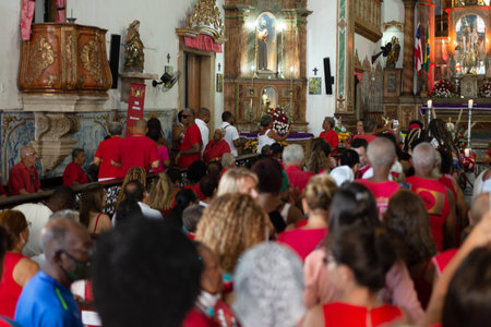Salvador, Bahia, Brazil - December 04, 2023: Candomble and Catholic believers are seen during mass...