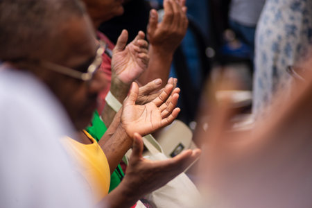 Salvador, Bahia, Brazil - December 13, 2023: Catholic faithful are seen praying during mass to Santa Luzia at Pilar Church in the city of Salvador, Bahia.のeditorial素材