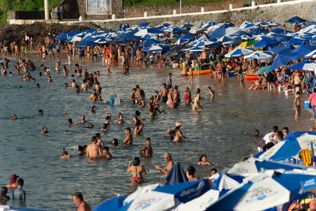 Salvador, Bahia, Brazil - January 05, 2022: People are seen bathing in the sea on Porto da Barra beach in the city of Salvador, Bahia.のeditorial素材