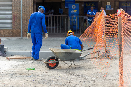 Salvador, Bahia, Brazil - January 05, 2024: Workers are seen during reconstruction work on Conceicao da Praia street in the commercial district in the city of Salvador, Bahia.のeditorial素材