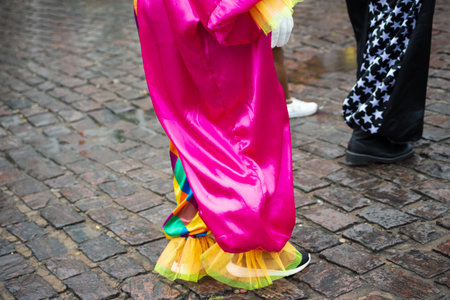 Maragogipe, Bahia, Brazil - February 11, 2024: Lower part of people in costumes having fun during the carnival in the city of Maragogipe, in Bahia.のeditorial素材