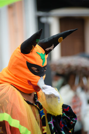 Maragogipe, Bahia, Brazil - February 11, 2024: People wearing Venetian carnival-style masks are seen during the carnival in the city of Maragogipe, in Bahia.のeditorial素材