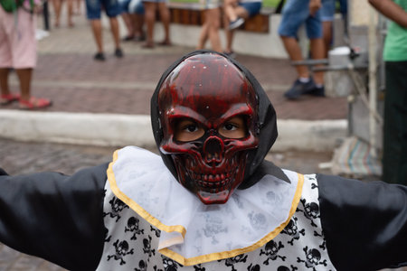 Maragogipe, Bahia, Brazil - February 11, 2024: People wearing horror masks are seen playing during...