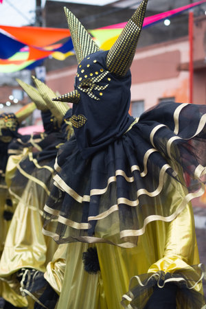Maragogipe, Bahia, Brazil - February 11, 2024: People dressed in Venice carnival style are seen during the carnival in the city of Maragogipe, in Bahia.のeditorial素材