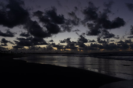 Dawn view with darkness, separated clouds. Drama of nature and beauty.の写真素材