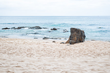 View of Farol da Barra beach with waves crashing on the rocks. Morning view.の写真素材