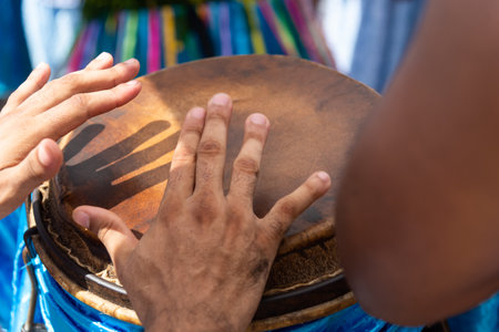 Percussionist hands playing atabaque. Tribute to Iemanja.