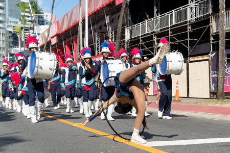 Salvador, Bahia, Brazil - February 03, 2024: Public school students are seen parading, playing and dancing during the Fuzue pre-carnival parade in the city of Salvador, Bahia.のeditorial素材