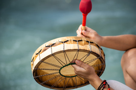 Salvador, Bahia, Brazil - February 02, 2024: People are seen playing percussion instruments during a party for Iemanja on Rio Vermelho beach in the city of Salvador, Bahia.のeditorial素材