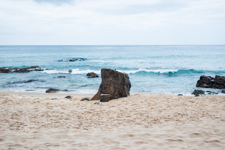 View of Farol da Barra beach with waves crashing on the rocks. Morning view.の写真素材