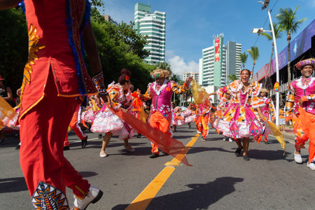 Salvador, Bahia, Brazil - February 03, 2024: Cultural group is seen parading dancing during the Fuzue pre-carnival parade in the city of Salvador, Bahia.のeditorial素材