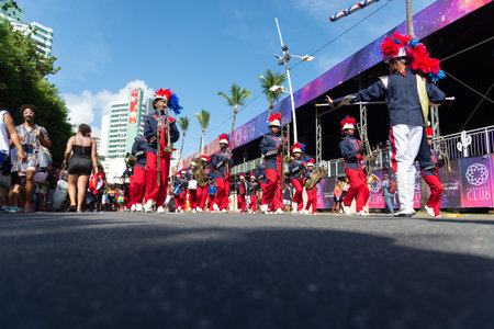 Salvador, Bahia, Brazil - February 03, 2024: Public school students are seen parading and playing musical instruments during the Fuzue pre-carnival parade in the city of Salvador, Bahia.のeditorial素材