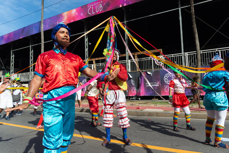 Salvador, Bahia, Brazil - February 03, 2024: Cultural group is parading during the Fuzue pre-carnival in the city of Salvador, Bahia.のeditorial素材