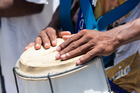 Percussionist hands playing atabaque. African music. Percussion instrument.の写真素材