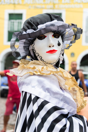 Maragogipe, Bahia, Brazil - February 11, 2024: People in costumes and masks play at the carnival in the city of Maragogipe in Bahia.のeditorial素材