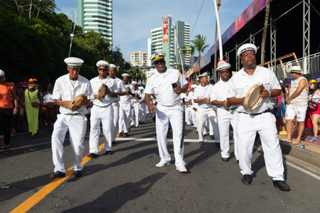 Salvador, Bahia, Brazil - February 03, 2024: Members of the cultural group Fragata Brasileira are seen parading during Fuzue, pre-carnival in the city of Salvador, Bahia.のeditorial素材