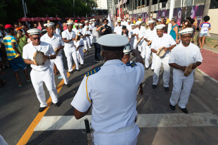 Salvador, Bahia, Brazil - February 03, 2024: Members of the cultural group Fragata Brasileira are seen parading during Fuzue, pre-carnival in the city of Salvador, Bahia.のeditorial素材
