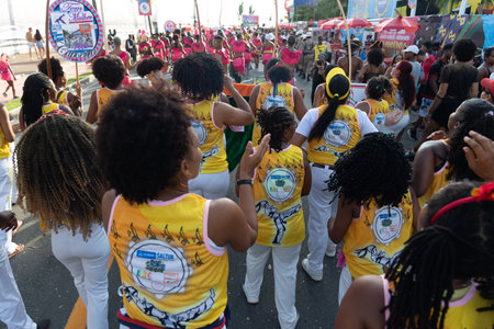 Salvador, Bahia, Brazil - February 03, 2024: People who are members of cultural groups are seen parading during Fuzue, pre-carnival in the city of Salvador, Bahia.のeditorial素材