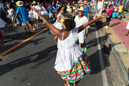 Salvador, Bahia, Brazil - February 03, 2024: People from cultural groups are seen parading during Fuzue, pre-carnival in the city of Salvador, Bahia.のeditorial素材