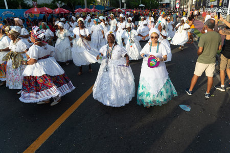 Salvador, Bahia, Brazil - February 03, 2024: People who are members of cultural groups are seen parading during Fuzue, pre-carnival in the city of Salvador, Bahia.のeditorial素材