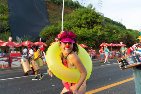 Salvador, Bahia, Brazil - February 03, 2024: People who are members of cultural groups are seen parading during Fuzue, pre-carnival in the city of Salvador, Bahia.のeditorial素材