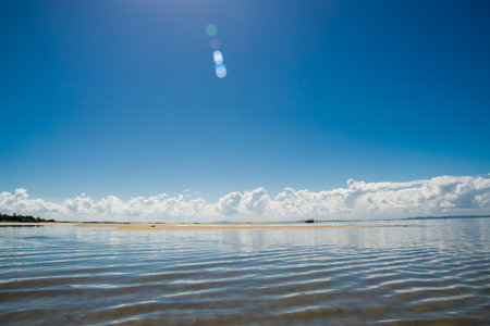 View of the sea with clouds and blue sky in the background. Beautiful and preserved nature.
