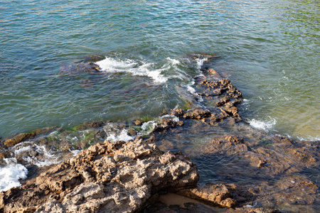Dark rocks in the sea. Preserved environment.の写真素材
