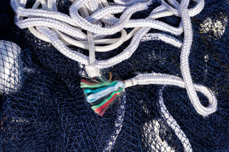 A balled-up blue professional fishing net. Fishing and leisure.の写真素材