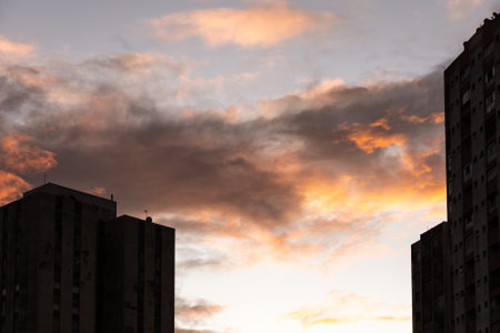 Contour, silhouette of two buildings against the orange sunset in the background. Salvador, Brazil.の写真素材