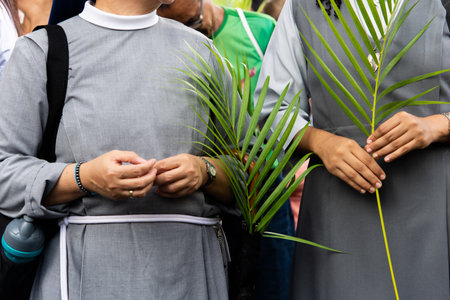Salvador, Bahia, Brazil - April 14, 2019: Nuns are seen praying and walking during Palm Sunday procession in the city of Salvador, Bahia.のeditorial素材