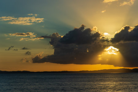 Dramatic orange sunset. Dark, large clouds. Environmentの写真素材