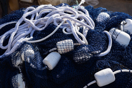 A balled-up blue professional fishing net. Fishing and leisure.の写真素材