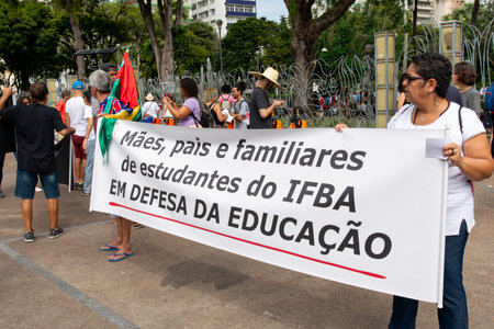 Salvador, Bahia, Brazil - August 13, 2019: Students are seen with flags during a protest against cuts to education by President Jair Bolsonaro in the city of Salvador, Bahia.のeditorial素材