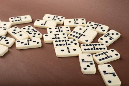 Dominoes with brown background, copy space and various angles, board games conceptの写真素材