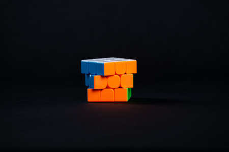 Salvador, Bahia, Brazil - May 15, 2024: Classic 3x3x3 Rubiks Cube on a black background. Rubiks Cube invented by Hungarian architect Erno Rubik in 1974.のeditorial素材