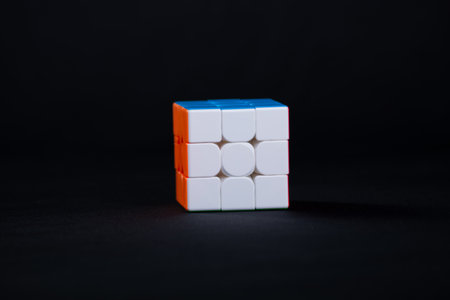 Salvador, Bahia, Brazil - May 15, 2024: Classic 3x3x3 Rubiks Cube on a black background. Rubiks Cube...