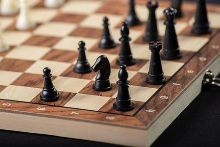 Chess board with pieces. Game concepts. Board game. Hobby. Game on black background.の写真素材