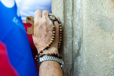 Salvador, Bahia, Brazil - July 27, 2024: Detail of the hands of a Catholic believer seen during mass in Pelourinho, historic center of the city of Salvador, Bahia.のeditorial素材