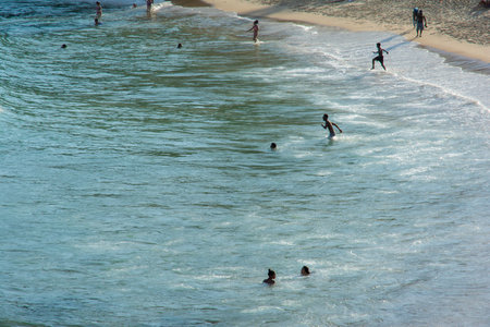 Salvador, Bahia, Brazil - July 06, 2019: People are seen bathing at PaciÃªncia beach in the city of Salvador, Bahia.のeditorial素材