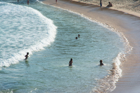 Salvador, Bahia, Brazil - July 06, 2019: People are seen bathing at PaciÃªncia beach in the city of Salvador, Bahia.のeditorial素材