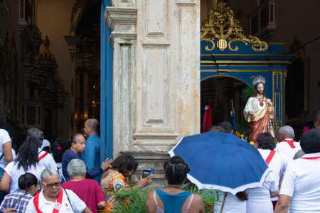 Salvador, Bahia, Brazil - July 27, 2019: Catholic faithful are participating in the procession of the Sacred Heart of Jesus in the historic center of the city of Salvador, Bahia.のeditorial素材
