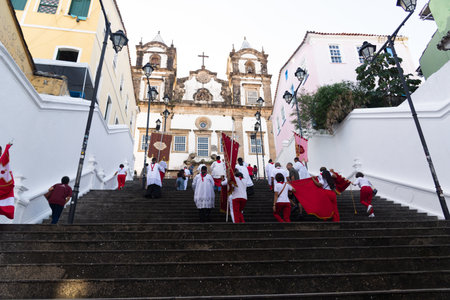 Salvador, Bahia, Brazil - July 27, 2024: Catholic faithful are seen climbing the steps of the Church of the Holy Sacrament of Passo in Pelourinho during a procession. Salvador, Bahia.のeditorial素材