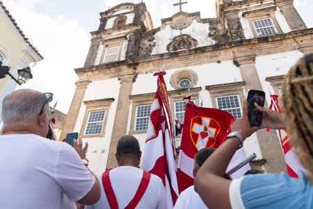 Salvador, Bahia, Brazil - July 27, 2024: Catholic faithful are seen climbing the steps of the Church of the Holy Sacrament of Passo in Pelourinho during a procession. Salvador, Bahia.のeditorial素材